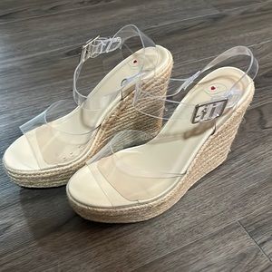 Size 7 wedges with clear straps. Never worn.